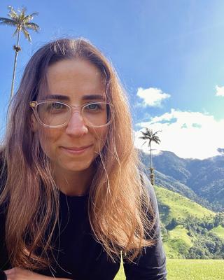 Portrait of Noga Marmor outdoors.
